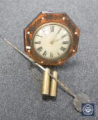 An antique timepiece with mother of pearl inlaid case together with two weights and pendulum