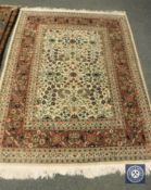 A Persian Kashan rug, 182 cm x 127 cm.