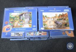 Approximately thirty-two jigsaws - Gibsons