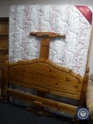 A pine 4'6 bed frame with mattress