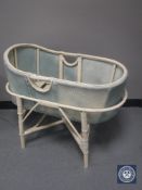 A mid 20th century painted loom carry cot on stand