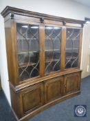 A Regency style inverted-bowed triple door mahogany bookcase CONDITION REPORT:
