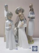 Five Nao figures including Shepherd with lamb, girl with puppy, girl with rabbit,