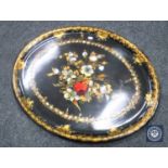 An oval Victorian papier-mache tray with mother of pearl inlay