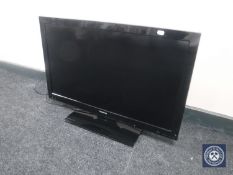 A Toshiba 32" LCD TV with remote