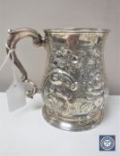 A George IV embossed silver tankard, London 1821 CONDITION REPORT: 355g.