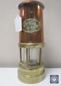 A Welsh brass and copper miner's lamp