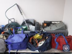 Two crates and four holdalls of power tools, extension leads,
