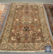 An antique Persian Isfahan rug, 213 cm x 153 cm.