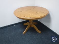 A circular pine extending table