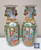 A pair of Chinese Canton porcelain famille rose baluster vases,