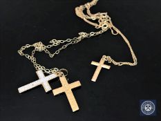 Two 9ct gold chains with silver crosses
