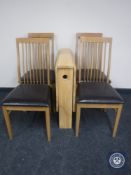 A narrow pine drop leaf table and four rail back chairs