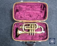 A leather cased brass Lafleur cornet