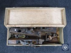 A joiner's tool box with wood working planes and joinery tools