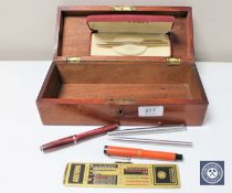 A mahogany box containing vintage Parker Duofold fountain pen with 14ct gold nib,