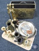 A brass embossed magazine rack together with a tray of brass and plated ware, candlesticks, jugs,