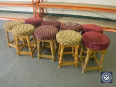 Nine upholstered pub stools