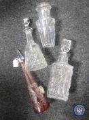 Three crystal decanters together with a water jug