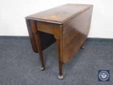 An oak drop leaf table on club feet CONDITION REPORT: Watermarks to top and general