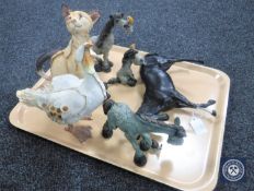 A tray of five animal figures together with a black gloss Beswick horse with foot raised