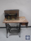A Singer treadle sewing machine in oak table