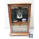 A Victorian oak glazed door fitted smoker's cabinet