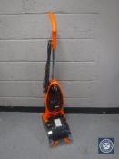 A carpet washer and a bundle of garden tools