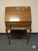 A Georgian style oak lady's bureau fitted with a drawer, width 56 cm.