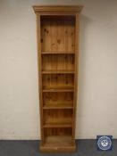 A set of narrow pine open shelves