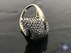 A diamond cluster ring, upon a yellow gold shank,