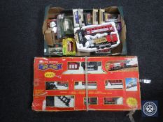 A box of assorted boxed die cast vehicles and a battery operated two in one Super Express train set
