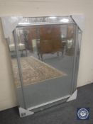 A silvered framed and glass mirror