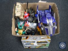 A box of transformers, voice changing helmets, remote control cars,