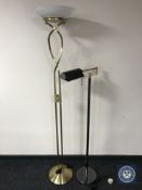 A brass uplighter and a reading floor lamp