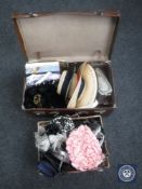 A vintage leather luggage case and a box of assorted fur hats, Ginghy wigs,