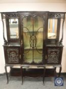 A late Victorian glazed mahogany mirrored backed display cabinet,