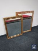 A gilt framed bevelled mirror together with a gilt floral framed mirror
