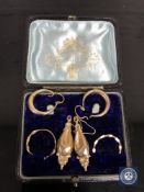 Three pairs of gold earrings