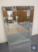 An all glass overmantel mirror