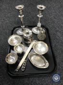 A pair of loaded silver candlesticks, silver bonbon dishes, atomiser,