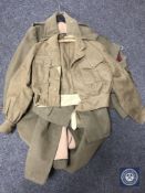 A WWII officer's trench coat and jacket together with one other military coat