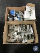 Two boxes of light fittings, socket covers,