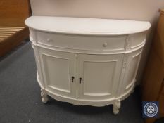 A white bow-fronted double door sideboard