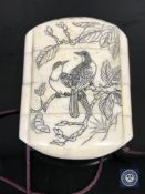 A Japanese bone four-section inro with penwork decoration depicting birds on a branch,