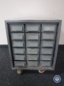 A metal Workshop chest fitted eighteen drawers
