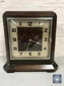 An oak cased Art Deco French mantel clock with pendulum CONDITION REPORT: Runs and