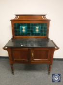 A late Victorian mahogany tiled wash stand, width 107 cm.