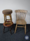 A pine kitchen chair together with a pine stool and an oak upholstered pub stool