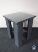 A contemporary Lloyd Loom glass topped occasional table